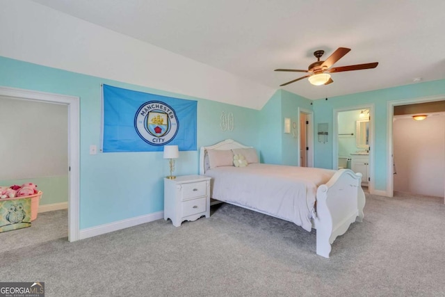 carpeted bedroom featuring ensuite bath and ceiling fan