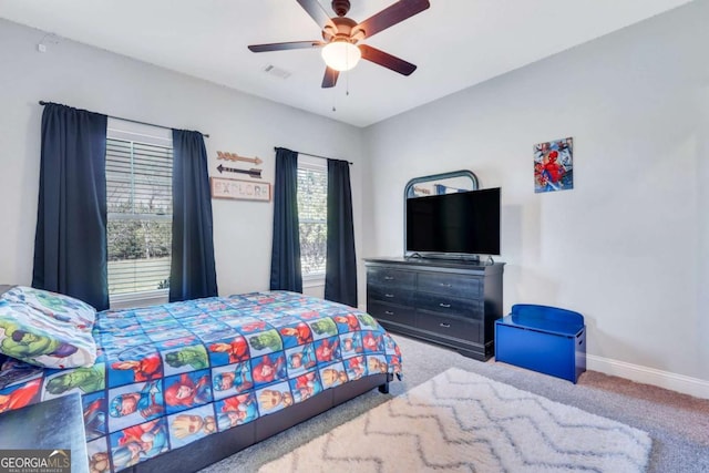 carpeted bedroom with ceiling fan