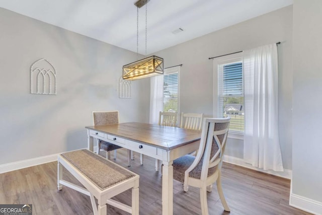 dining area with hardwood / wood-style flooring