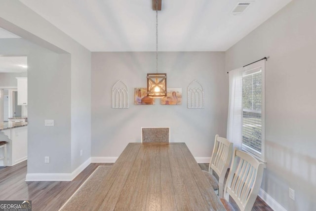 dining room featuring dark hardwood / wood-style flooring