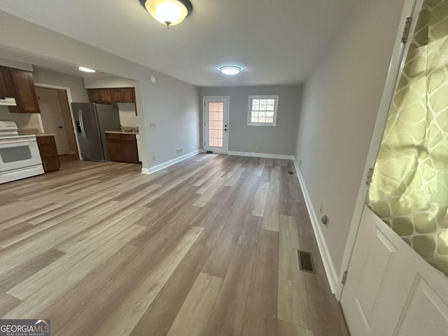 unfurnished living room featuring light hardwood / wood-style flooring