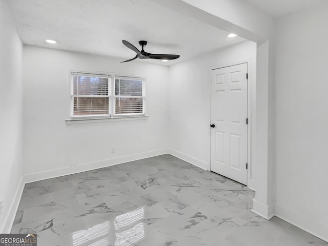 spare room featuring ceiling fan