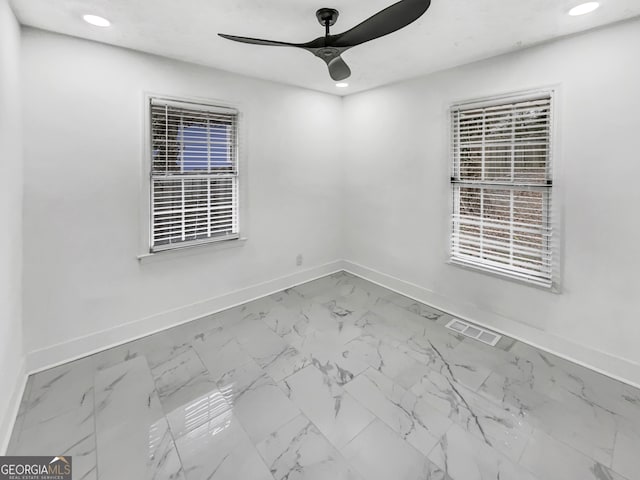 empty room featuring ceiling fan