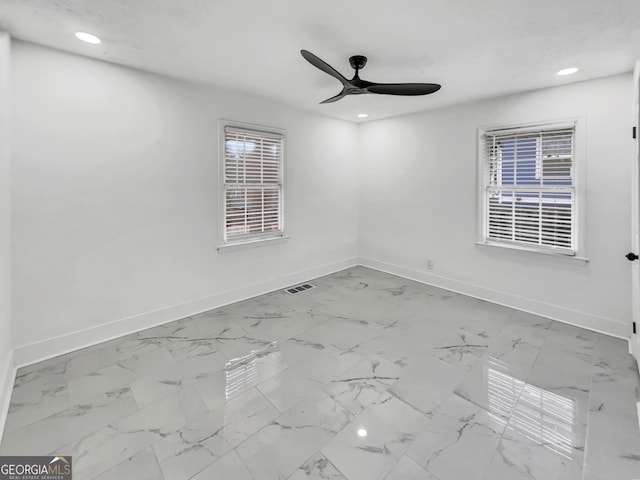 spare room with ceiling fan