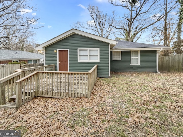 back of property with a wooden deck