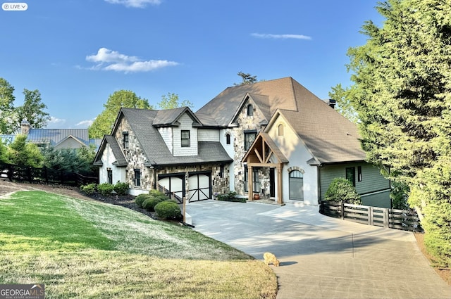 view of front of home featuring a garage and a front yard