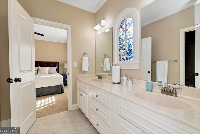 bathroom featuring crown molding, tile patterned floors, and vanity