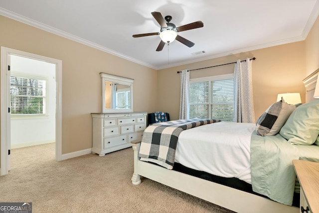 carpeted bedroom featuring multiple windows, ornamental molding, and ceiling fan