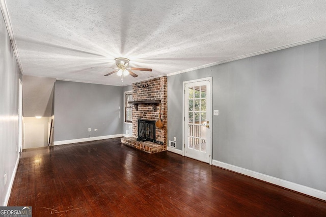 unfurnished living room featuring crown molding, ceiling fan, a fireplace, wood-type flooring, and a textured ceiling