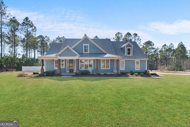 view of front of house with a porch and a front lawn