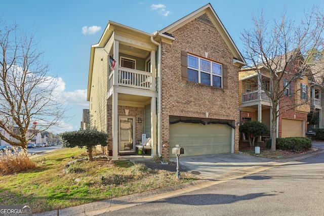 view of front of property with a garage, driveway, and brick siding