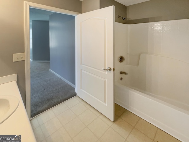 bathroom with vanity, tile patterned floors, and washtub / shower combination