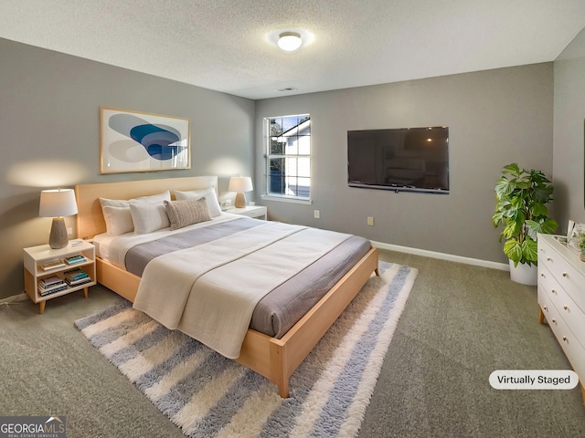 carpeted bedroom featuring a textured ceiling