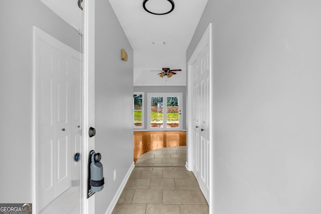 corridor with light tile patterned flooring