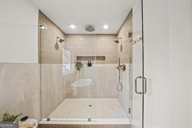 full bath featuring a shower stall