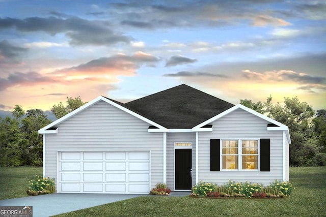 view of front of property featuring a garage and a yard