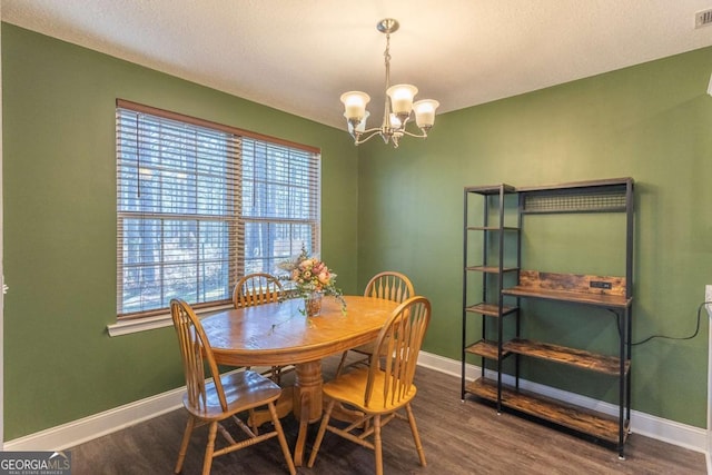 dining room featuring an inviting chandelier and wood-type flooring