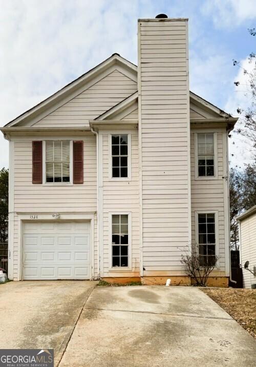 exterior space with a garage