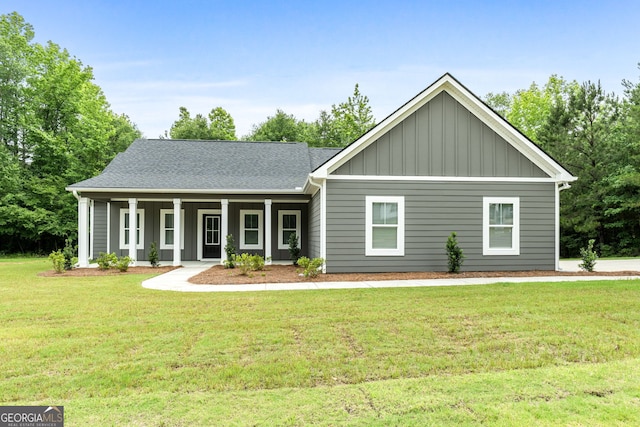 910 Bevis Rd, Franklin, GA 30217 - view of front of house featuring board and batten siding, a front lawn, covered porch, and a shingled roof