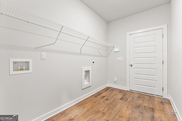 910 Bevis Rd, Franklin, GA 30217 - laundry room featuring electric dryer hookup, hookup for a washing machine, wood finished floors, and baseboards