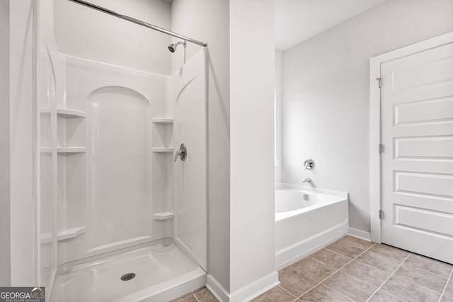 910 Bevis Rd, Franklin, GA 30217 - full bath with a shower, baseboards, tile patterned floors, and a garden tub