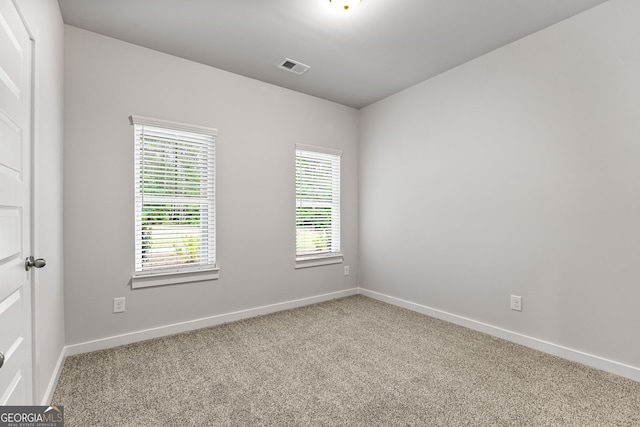 910 Bevis Rd, Franklin, GA 30217 - carpeted empty room with plenty of natural light and baseboards