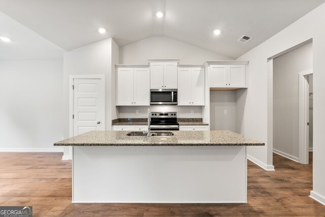 910 Bevis Rd, Franklin, GA 30217 - kitchen with appliances with stainless steel finishes, a sink, lofted ceiling, white cabinets, and light stone countertops