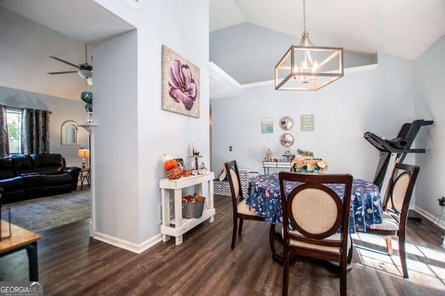 dining area with dark hardwood / wood-style flooring, ceiling fan with notable chandelier, and vaulted ceiling