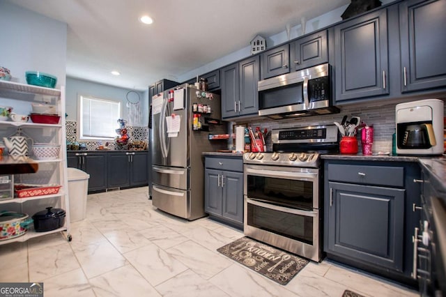 kitchen featuring tasteful backsplash and stainless steel appliances