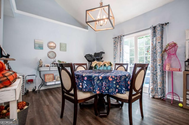 dining room with lofted ceiling, dark hardwood / wood-style flooring, and a chandelier