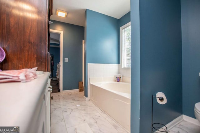 bathroom with a bathing tub and toilet