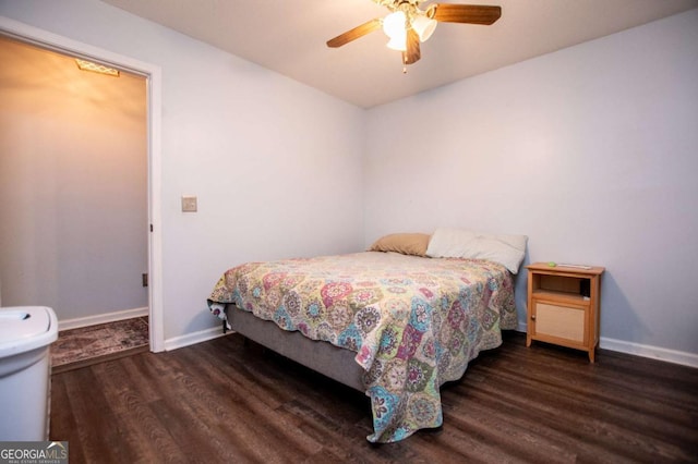 bedroom with dark hardwood / wood-style flooring and ceiling fan