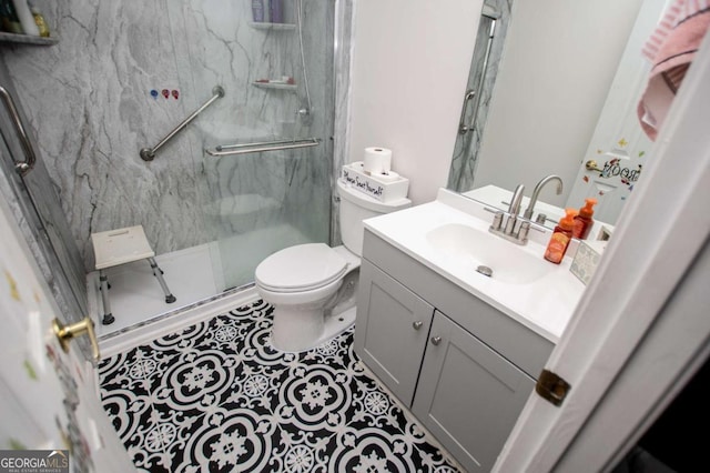 bathroom with vanity, toilet, an enclosed shower, and tile patterned flooring