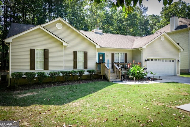 ranch-style home featuring a garage and a front yard