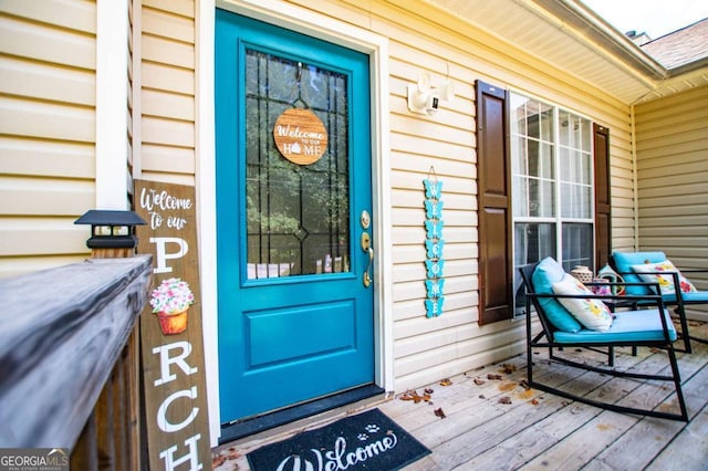 view of exterior entry with covered porch