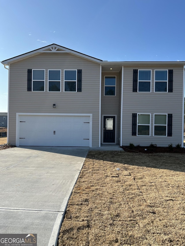 view of front of property with a garage