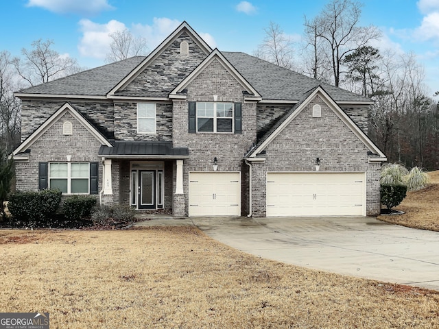 view of front of home with a garage and a front yard