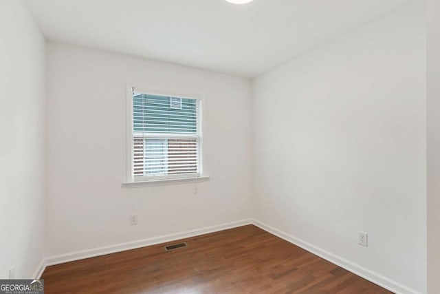 empty room with wood-type flooring