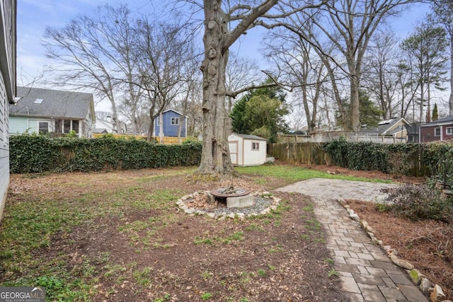 view of yard with a storage unit