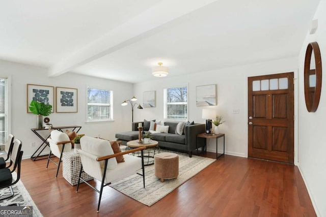 living room featuring dark hardwood / wood-style flooring and beamed ceiling