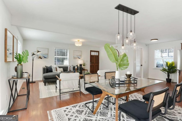 dining space with light hardwood / wood-style floors