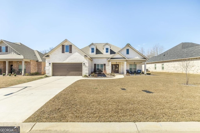 view of front of home with a front yard and concrete driveway