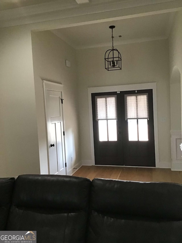 foyer entrance featuring french doors and light wood-type flooring