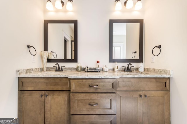 bathroom with double vanity and a sink