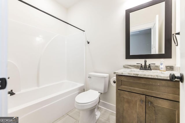 bathroom with toilet, baseboards, shower / washtub combination, and vanity