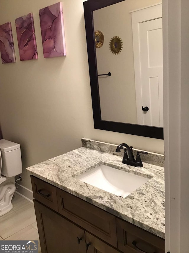 bathroom with vanity and toilet