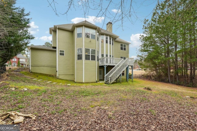 back of house featuring a deck