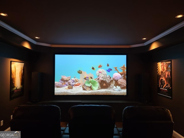 home theater room featuring built in desk, recessed lighting, and crown molding