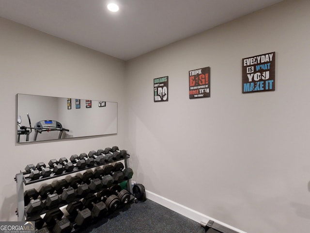 workout room featuring baseboards and recessed lighting