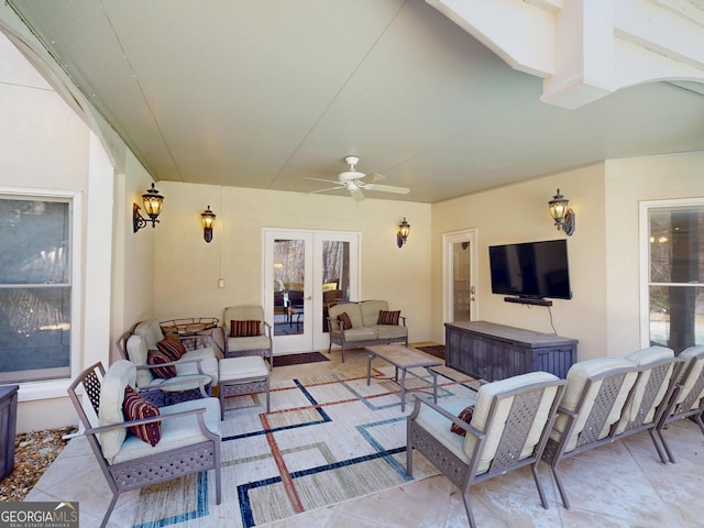 view of patio / terrace featuring outdoor lounge area, a ceiling fan, and french doors